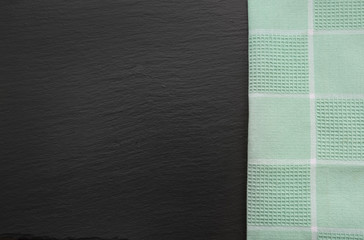 Fototapeta premium Rustic napkin and black slate dish with copy space for your menu or recipe. Menu card for restaurants.