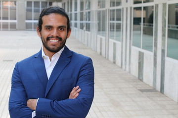 Ethnic business confident man posing with folded arms - Stock image with copy space 