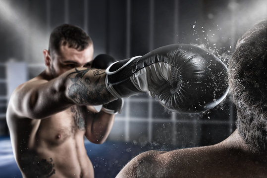 Boxer in a boxe competition beats his opponent