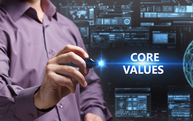 Business, Technology, Internet and network concept. Young businessman working on a virtual screen of the future and sees the inscription: Core values