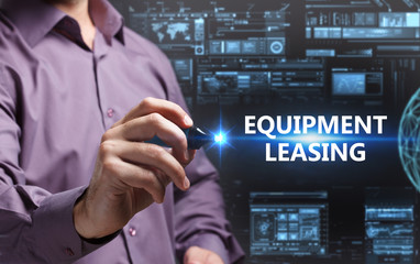 Business, Technology, Internet and network concept. Young businessman working on a virtual screen of the future and sees the inscription: Equipment leasing