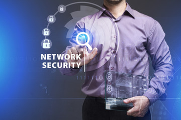 Business, Technology, Internet and network concept. Young businessman working on a virtual screen of the future and sees the inscription: Network security