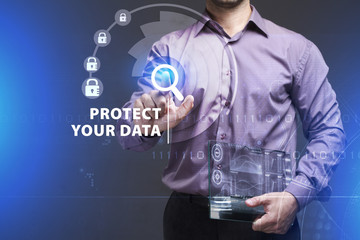 Business, Technology, Internet and network concept. Young businessman working on a virtual screen of the future and sees the inscription: Protect your data