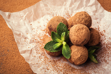 Chocolate truffle,Truffle chocolate candies with cocoa powder.Homemade fresh energy balls with chocolate.Gourmet assorted truffles made by chocolatier.Chunks of chocolate and coffee beans