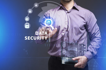 Business, Technology, Internet and network concept. Young businessman working on a virtual screen of the future and sees the inscription: Data security