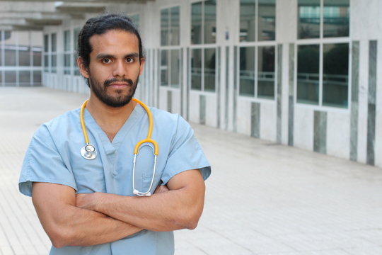 Ethnic health care worker posing confident with arms crossed - Stock image with Copy Space