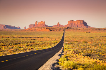 Monument Valley with U.S. Highway 163 at sunset, Utah, USA