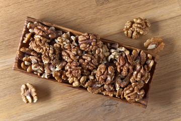 Walnuts in old wooden dish