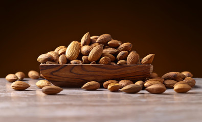 Almonds in old wooden dish