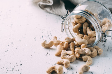 Cashew nuts in a jar on the old table