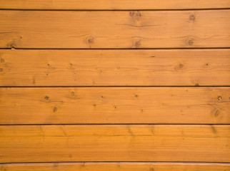 Naklejka premium The wood plank texture background. Brown wooden wall made from lots of boards. part of the wall made of wooden logs.