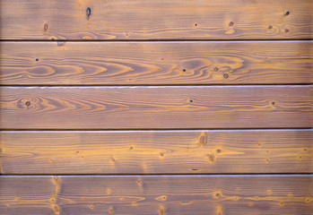 The wood plank texture background. Brown wooden wall made from lots of boards. part of the wall made of wooden logs.