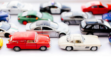 Toy cars with top view on white background
