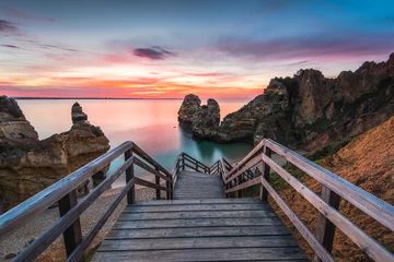 Acrylic prints Descent to the beach Wooden footbridge walkway to beautiful beach Praia do Camilo on coast of Algarve region, Portugal