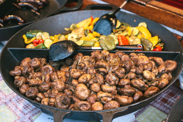 Of grilled vegetables. Vegetarian food. The outdoors and cooking on the fire. The street food. Prepared food on the market and special trading food stalls. The sale and purchase of food.