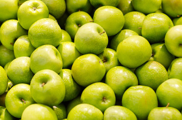 Bunch of green apples in supermarket