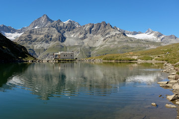 Swiss mountains reflected in lake Schwarzsee, near Zermatt, Switzerland.