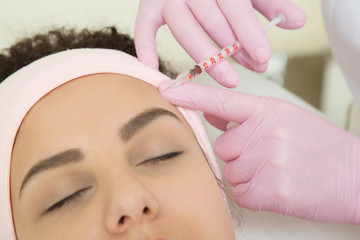 Young woman visiting cosmetologist