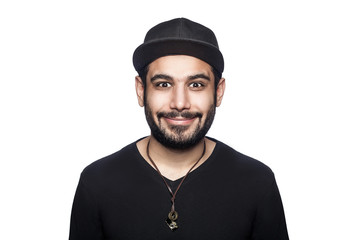Portrait of young happy smilely man with black t-shirt and cap looking at camera with  smile. studio shot, isolated on white background.