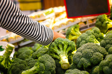 Fresh organic broccoli in supermarket