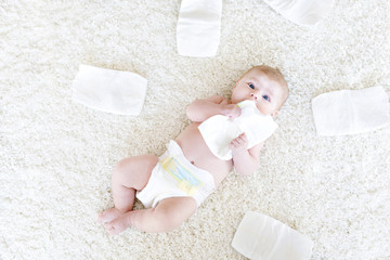 newborn baby girl with diapers. Dry skin and nursery