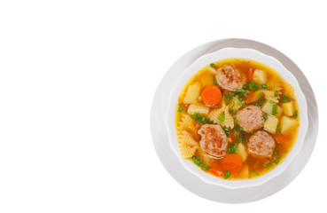Soup with meatballs and vegetables. top view. isolated on white