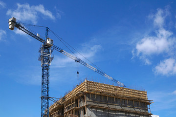 Tower crane building a building