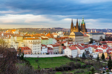 Fototapeta na wymiar Spring Prague panorama from Prague Hill with Prague Castle, Vltava river and historical architecture. Concept of Europe travel, sightseeing and tourism.