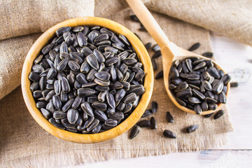 Fresh Sunflower seed. Shelled sunflower seeds in wood bowl.