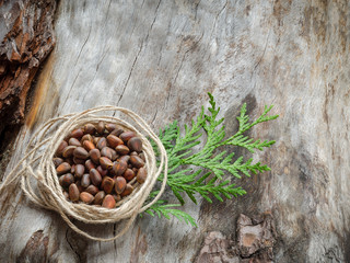 Unshelled pine nuts on aged wood