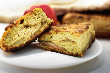 Two pieces of fresh pie charlotte on a white plate. homemade baking