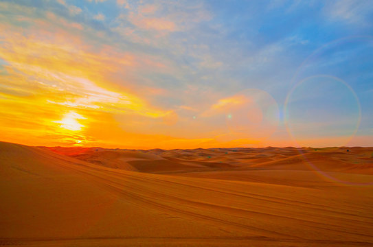 Sunset in the beautiful sand dunes of Dubai