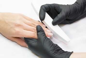 Woman doing manicure beauty salon 