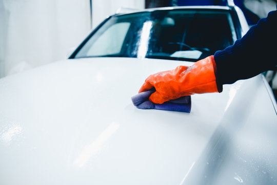 hands hold sponge for washing car. Concept manual car wash for cars.