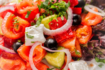 Fresh Greek salad with onion. Close up with selective focus