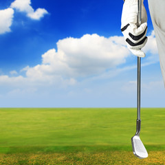 Fototapeta na wymiar Golf player holding a golf club in golf course