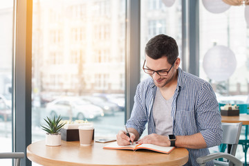 Young stylish man in cafe