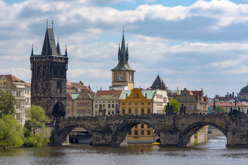 Charles Bridge over Vltava river and Old town in Prague
