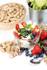 Strawberries, blueberry, nuts, chocolate and mint as the delicious healthy dessert.