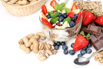 Strawberries, blueberry, nuts, chocolate and mint as the delicious healthy dessert.