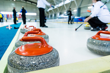 Curling stone on a game sheet.