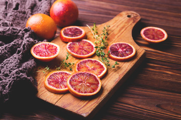 Citrus fruit background with sliced red bloody oranges