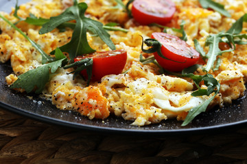Traditional breakfast - fried eggs,ruccola, tommato- - diet concept scrambled eggs