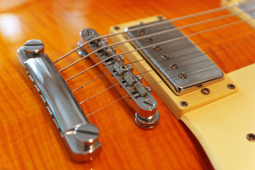 Closeup of the electric guitar. Detail, selective focus.