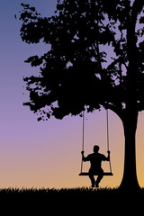 silhouette on swing at sunset