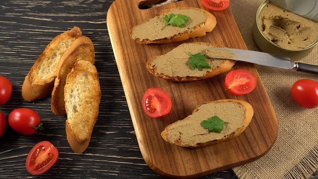 Fresh pate with bread on wooden table