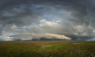 Obraz premium Clouds over the steppe.