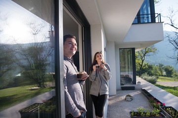 couple enjoying on the door of their luxury home villa