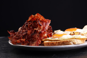 Ham and Egg. Bacon and Egg. Salted egg and sprinkled with black pepper. English breakfast.