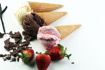 three scoops of ice cream - vanilla, strawberry and chocolate